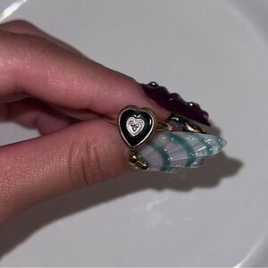 SOLID GOLD 10k Onyx Heart Ring W/ 925 sterling silver middle.